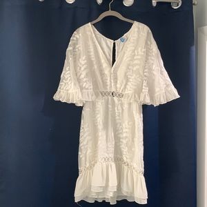 Selfie Leslie White dress,cape sleeves,cut details around bust, peep open back.